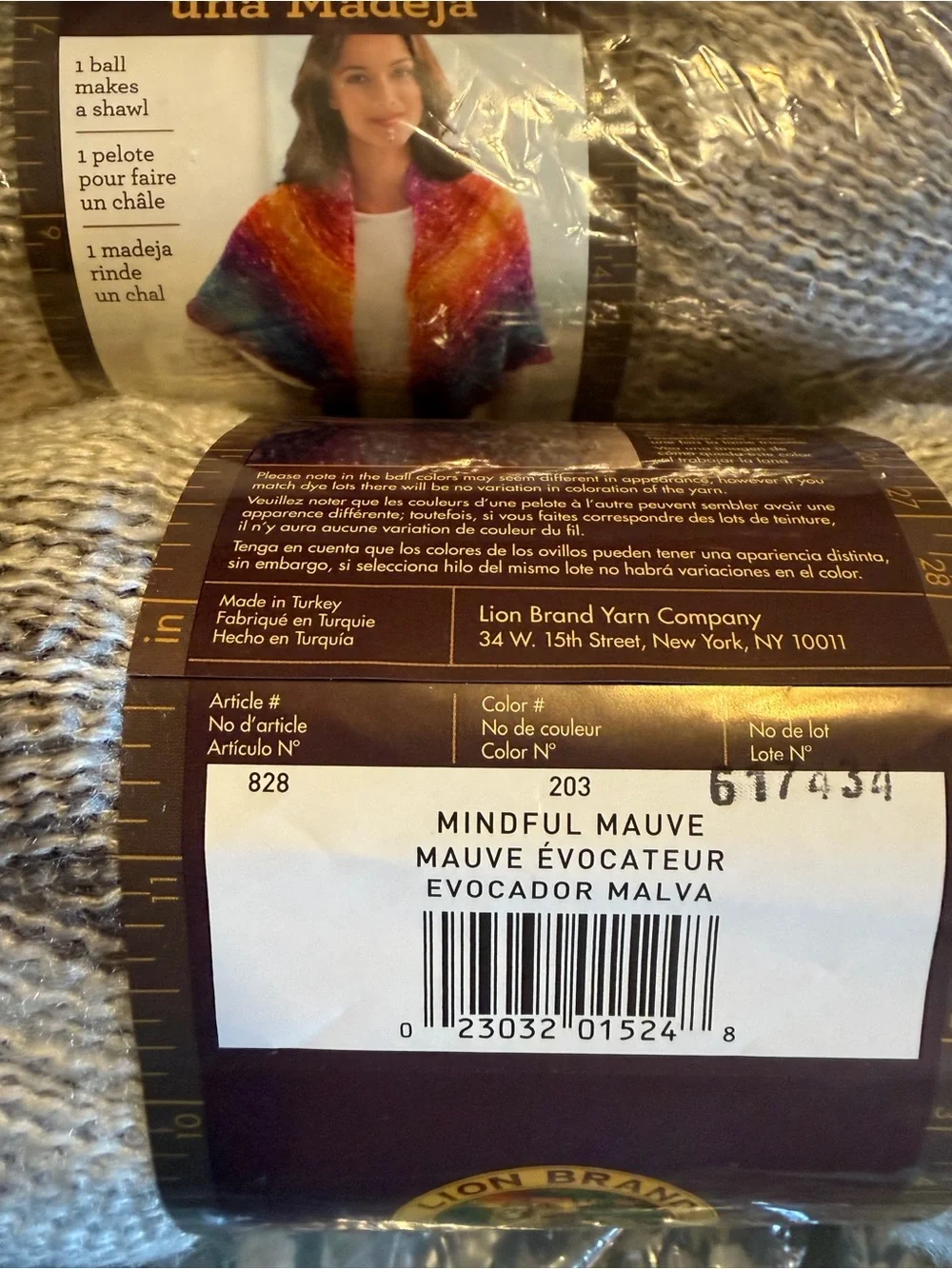 Lion brand shawl in a ball in mindful mauve, two balls new in plastic.